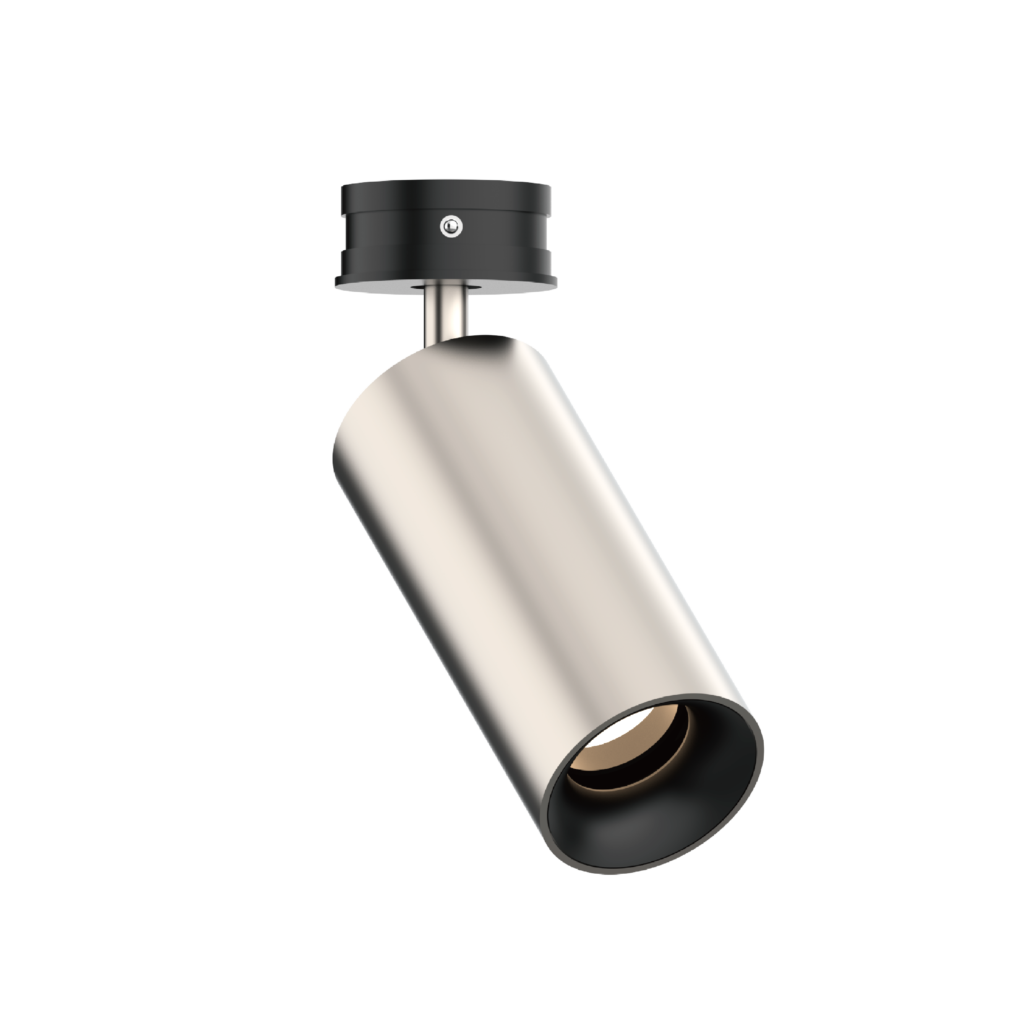 Close-up of a black cylindrical ceiling light fixture hanging from a metal rod on a black background