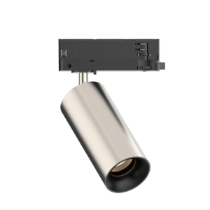 Close-up of a black electronic module mounted on a metallic pole, showing a small red indicator and a right-side connector with two gold pins.