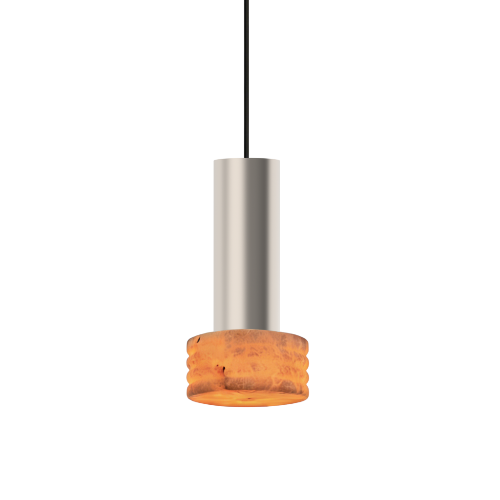 A glazed orange donut pierced on a vertical rod over a cream base, set against a black background.