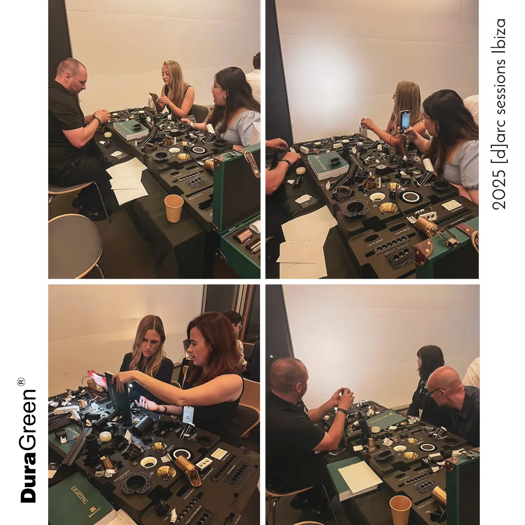 Group of people at a jewelry-making workshop, seated around workbenches with tools, rings, and components laid out on the table.