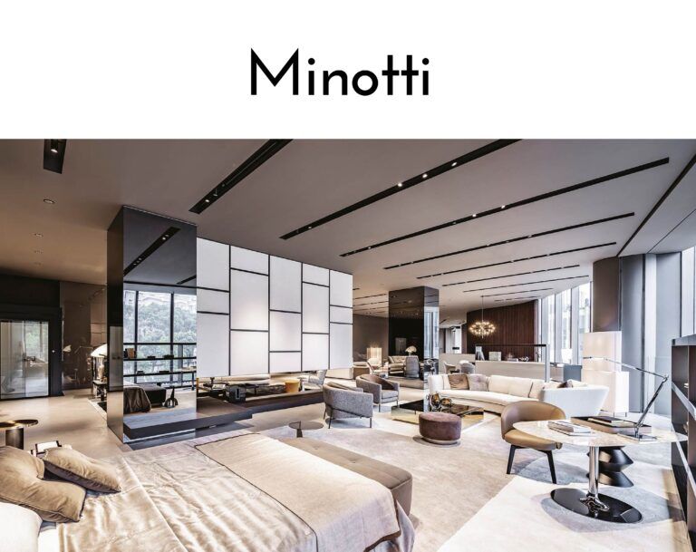 Open-plan furniture showroom featuring beige sofas, glass partitions, and minimalist black ceiling lights in a luxurious modern space.