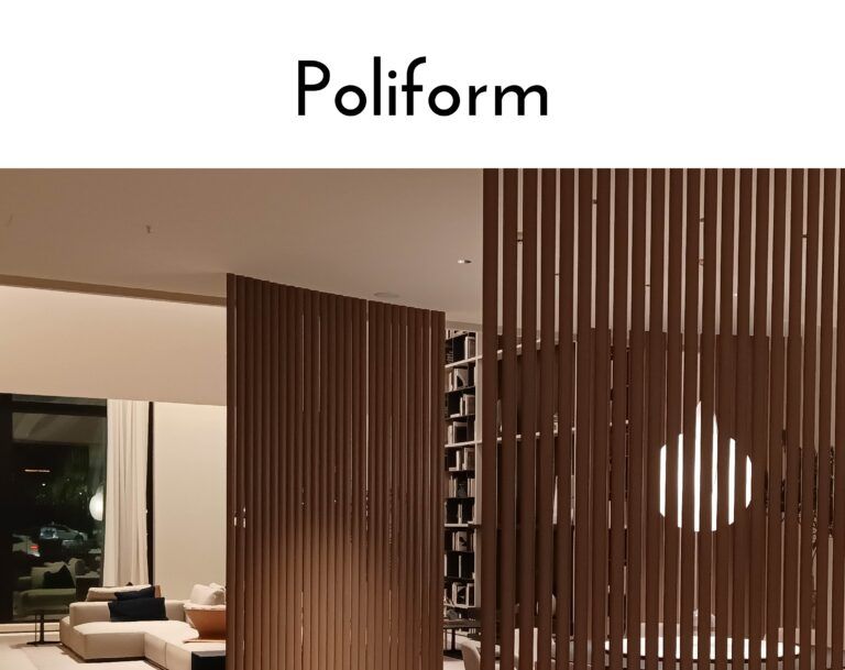 Interior lounge with a tall brown vertical slat partition dividing seating areas.