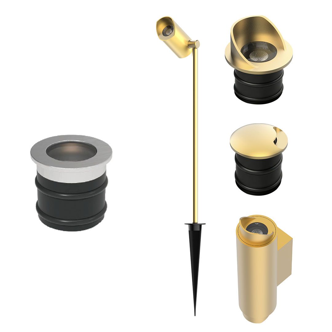 Collection of gold and black architectural lighting components: ground spike, recessed light housing, and several caps/covers.