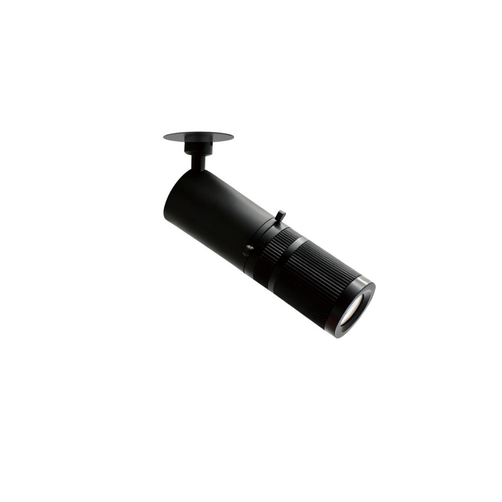 Close-up of a black stage spotlight with a circular reflector on top, set against a black background.