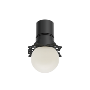 A-11 | DuraGreen Close-up of a dark gray cylindrical object with a rounded top, mounted on a perforated circular base, against a black background.