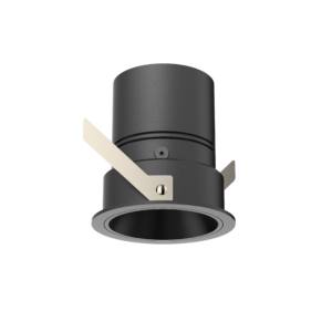 Close-up of a matte gray metal cylinder with beige masking tape wrapped diagonally around it.
