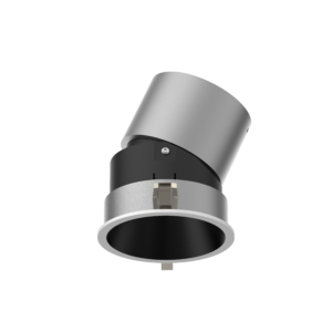 Close-up of a silver cylindrical device with a black base and a large curved metallic sleeve, photographed against a black background.
