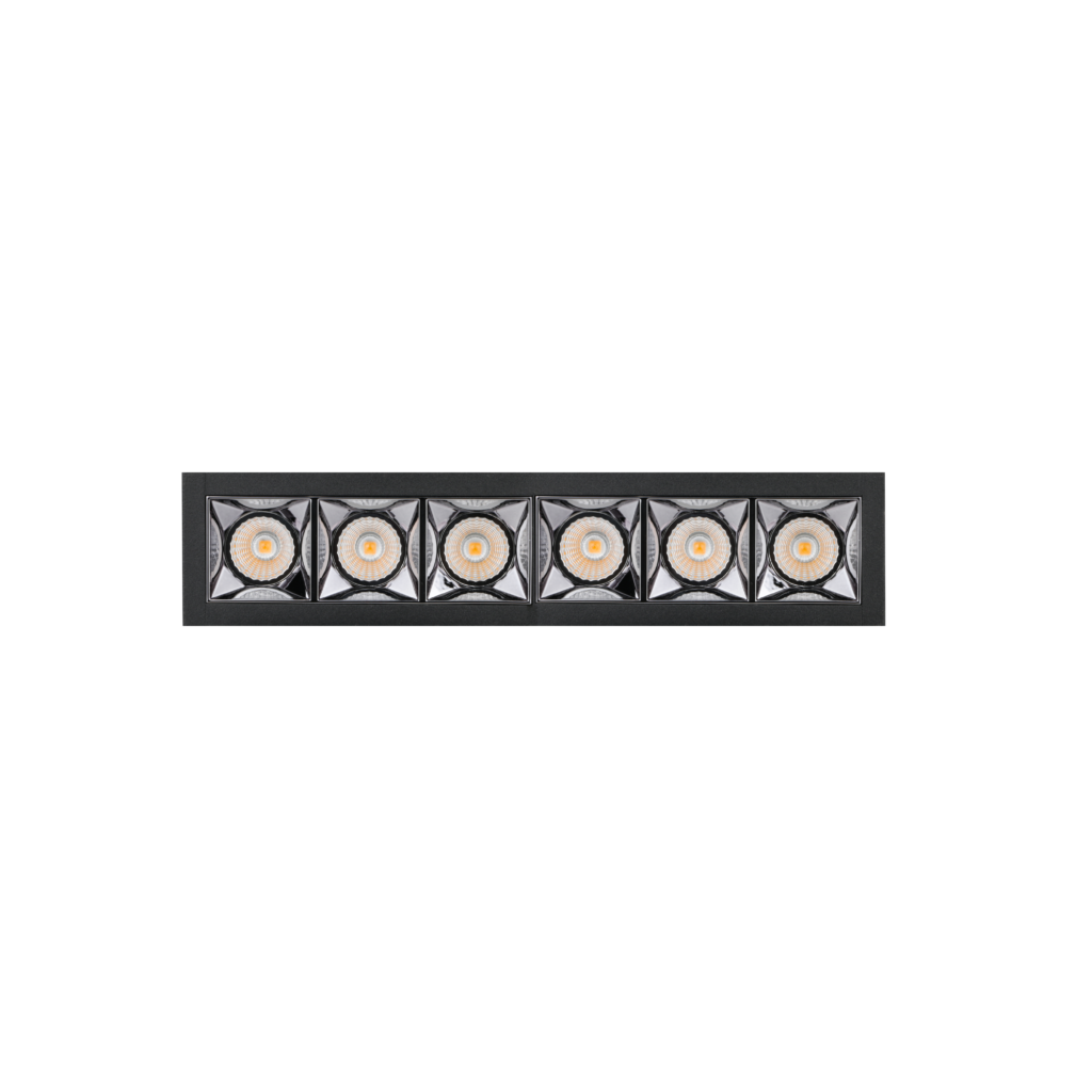 Close-up of a dark metal wall sconce with six square glass panels, each containing a circular LED light with an orange center.