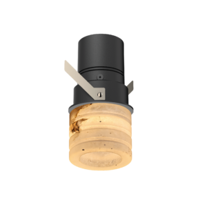Close-up of a black cylindrical spotlight with beige mounting brackets and a lit round bulb at the bottom, viewed from below.