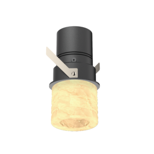 AS-01 | DuraGreen Close-up of a dark cylindrical ceiling light with beige metal brackets and a warm amber glass shade beneath it.