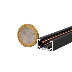 Close-up of euro coins resting beside a black metal tool with copper rods on a black background.