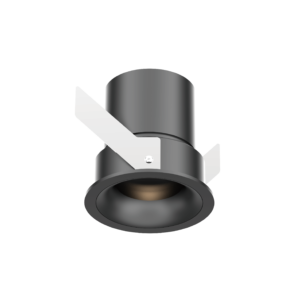 Close-up of a metallic cylindrical object with a curved surface and overlapping light-gray braces, set against a black background.